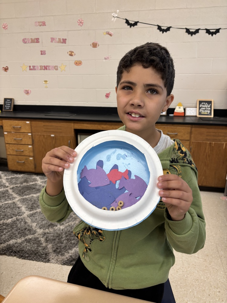 student with their aquarium