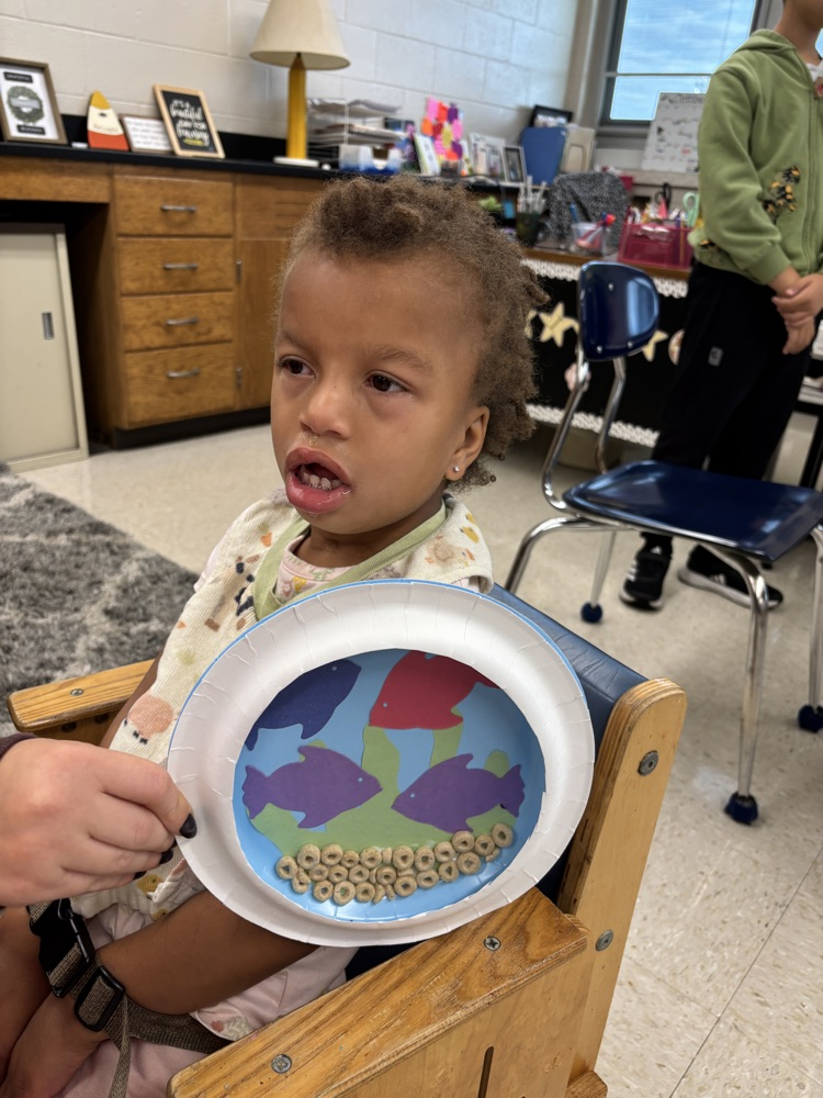 student with their aquarium