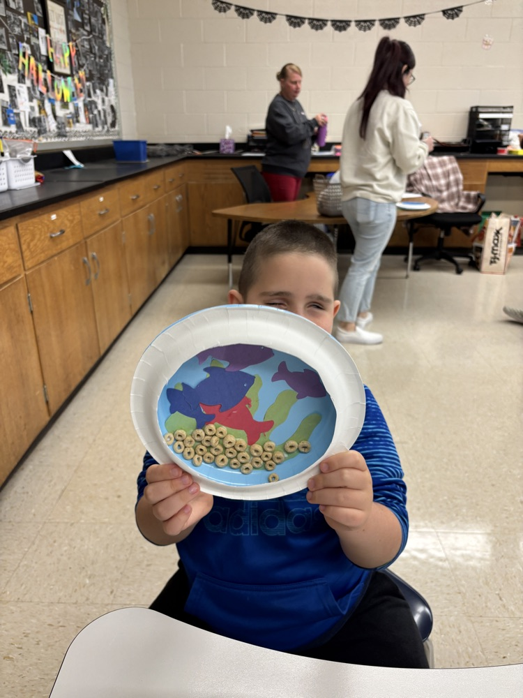 student with their aquarium