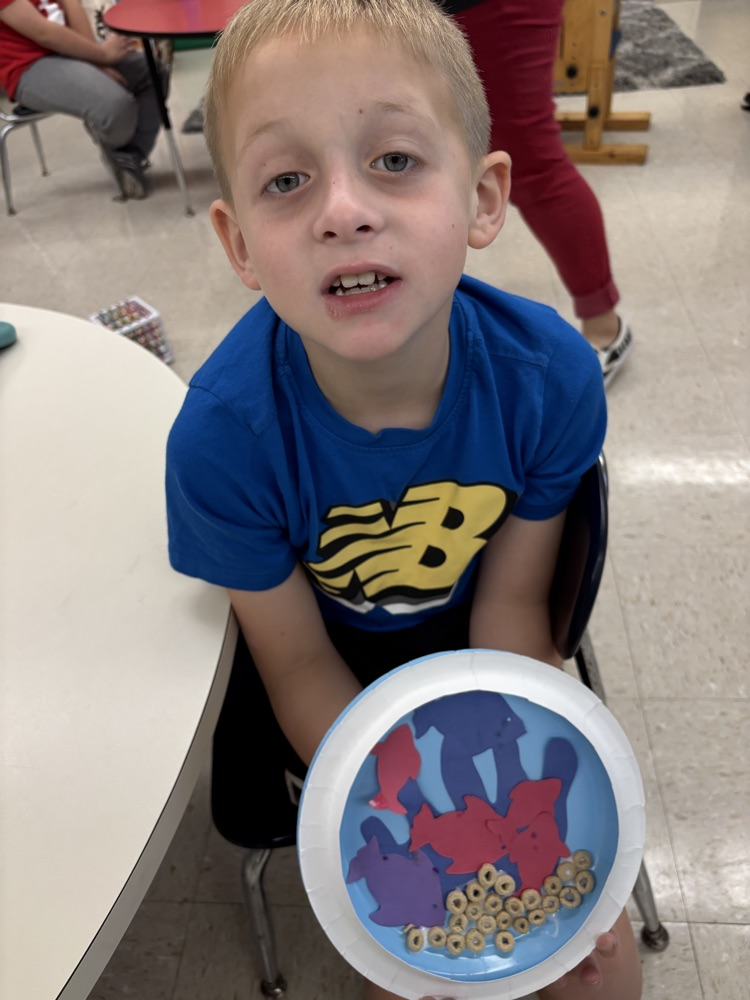 student with their aquarium