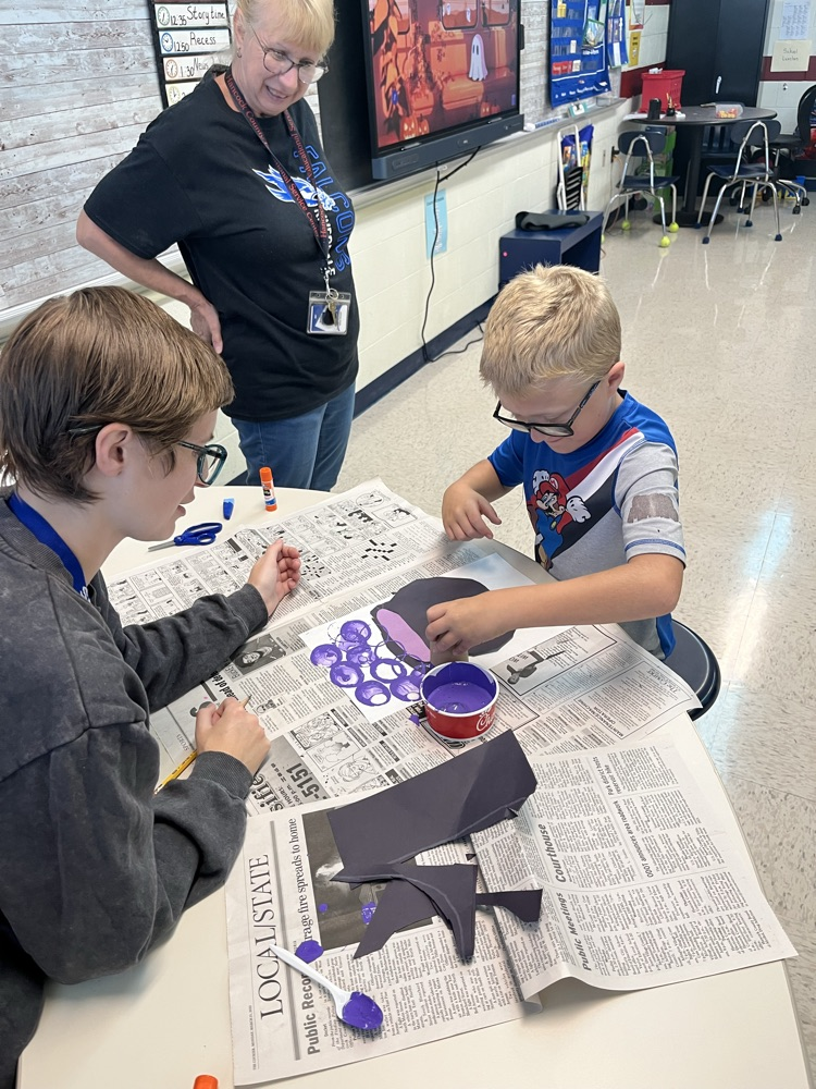 student making bubble art