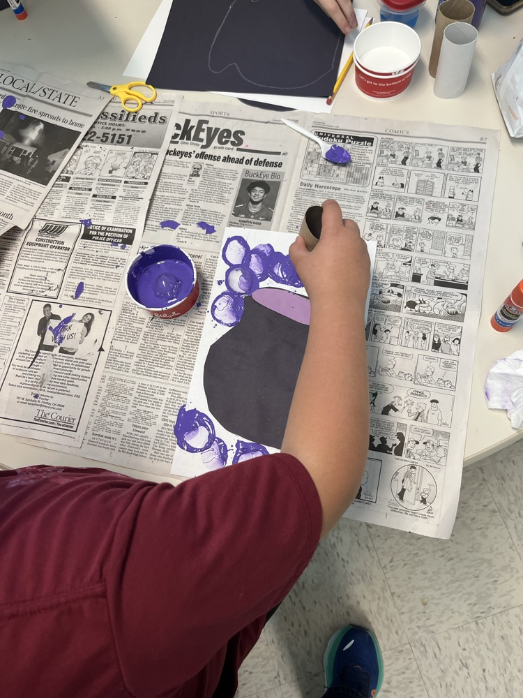 student making bubble art