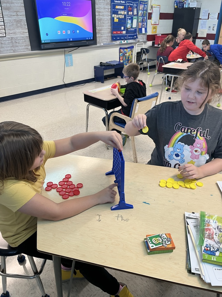 students playing games and taking turns