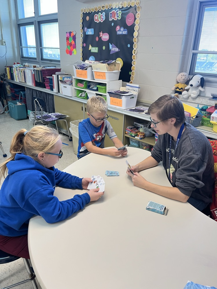 students playing games and taking turns