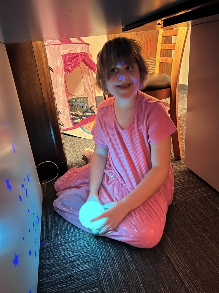 student playing with glow ball