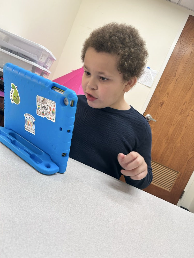 student getting iPad time
