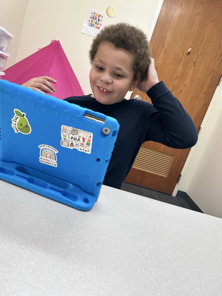 student getting iPad time