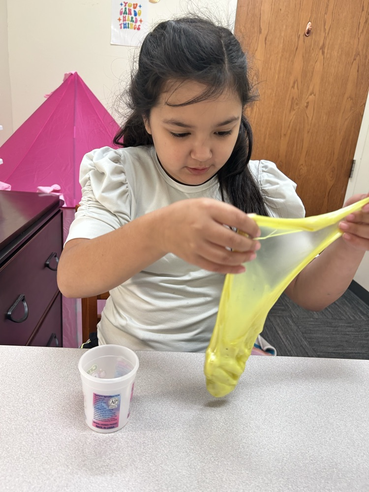 student playing with slime