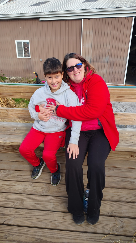 student and parent on wagon