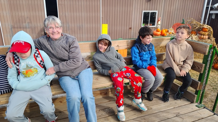 students and teacher on wagon