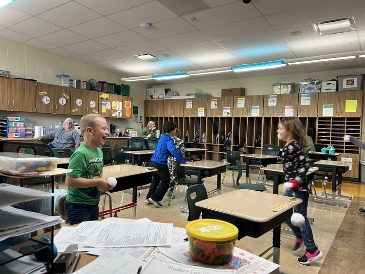 students throwing play snowballs