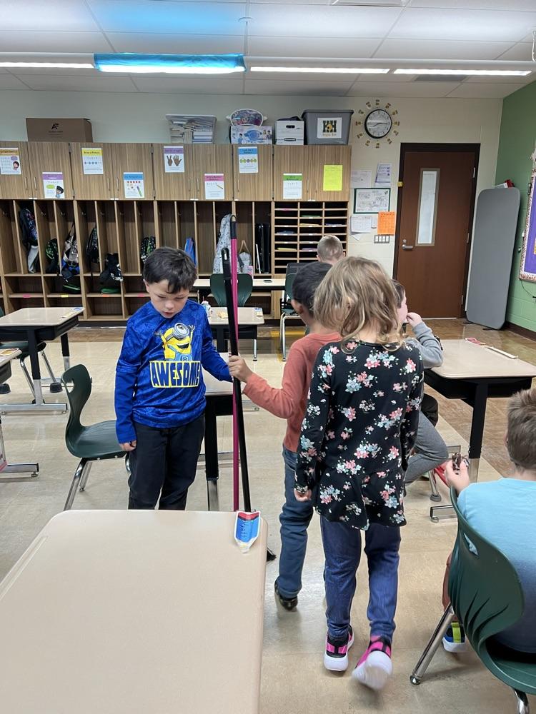 students cleaning play snowballs