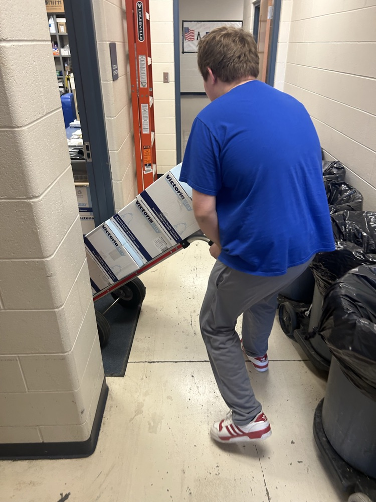 student collecting paper and cardboard