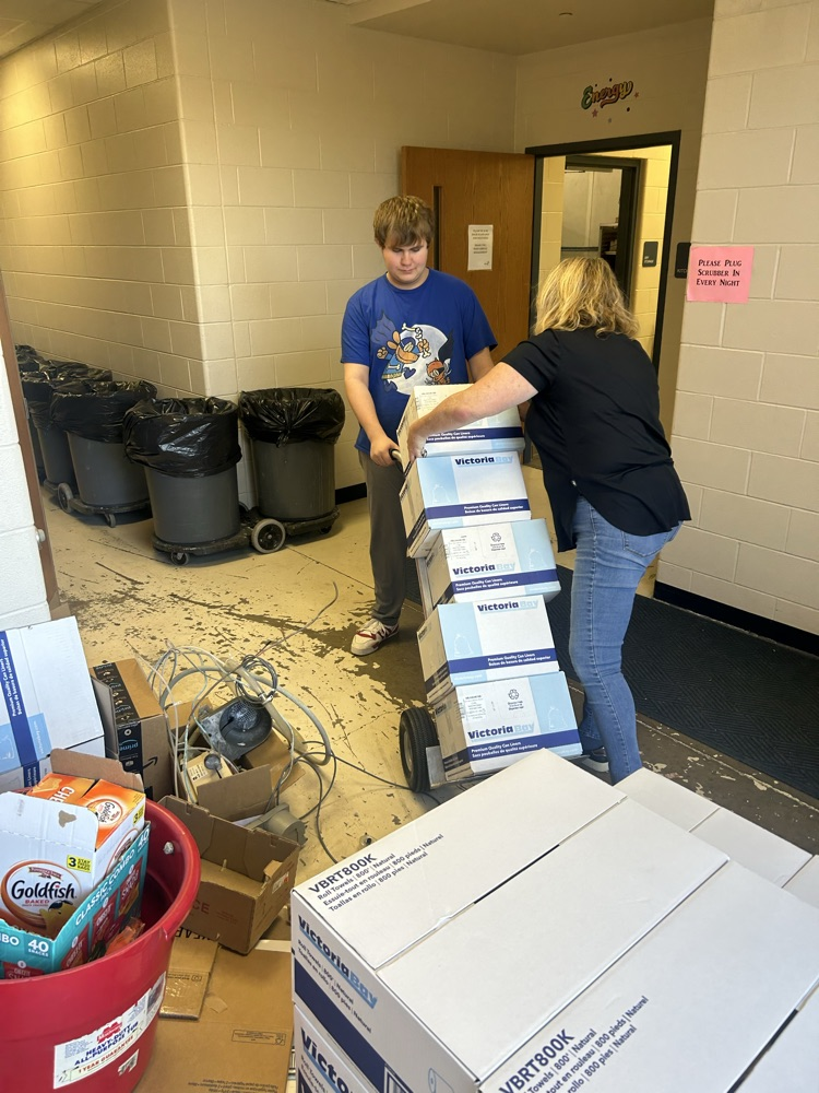 student collecting paper and cardboard
