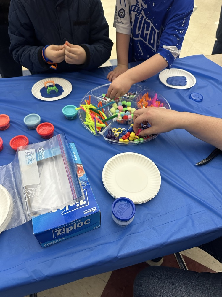 students crafting monsters with playdoh