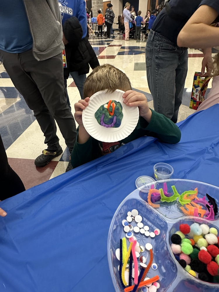 students crafting monsters with playdoh