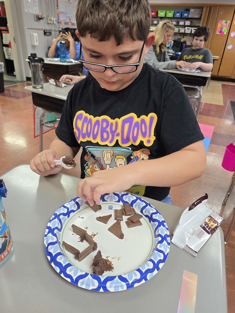 student making a house made of chocolate