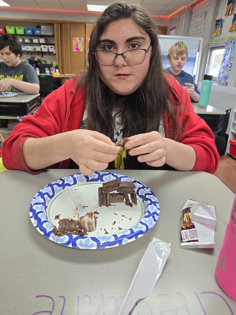 student making a house made of chocolate