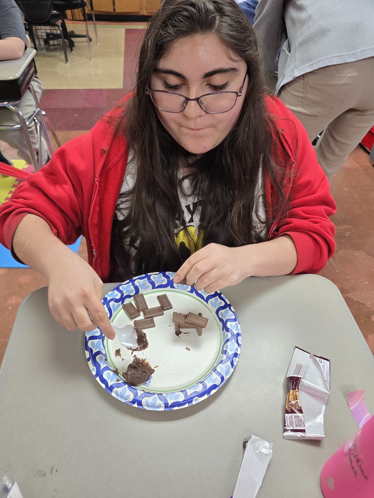 student making a house made of chocolate