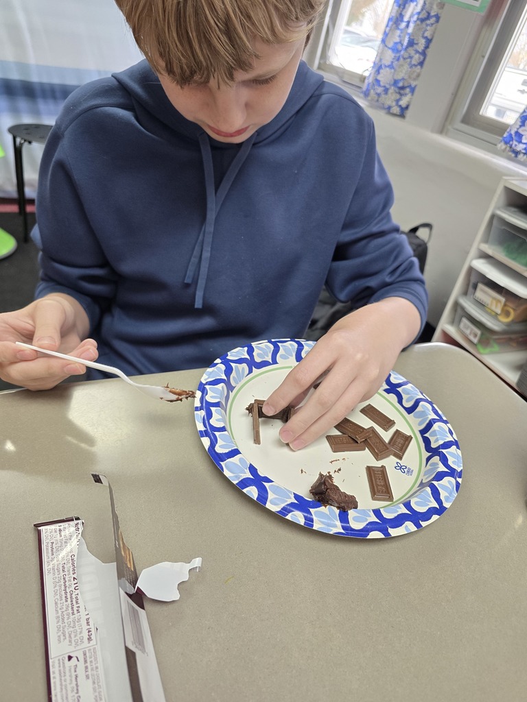 student making a house made of chocolate