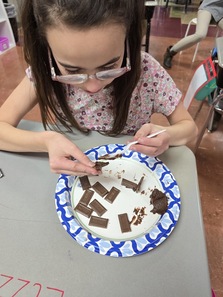 student making a house made of chocolate