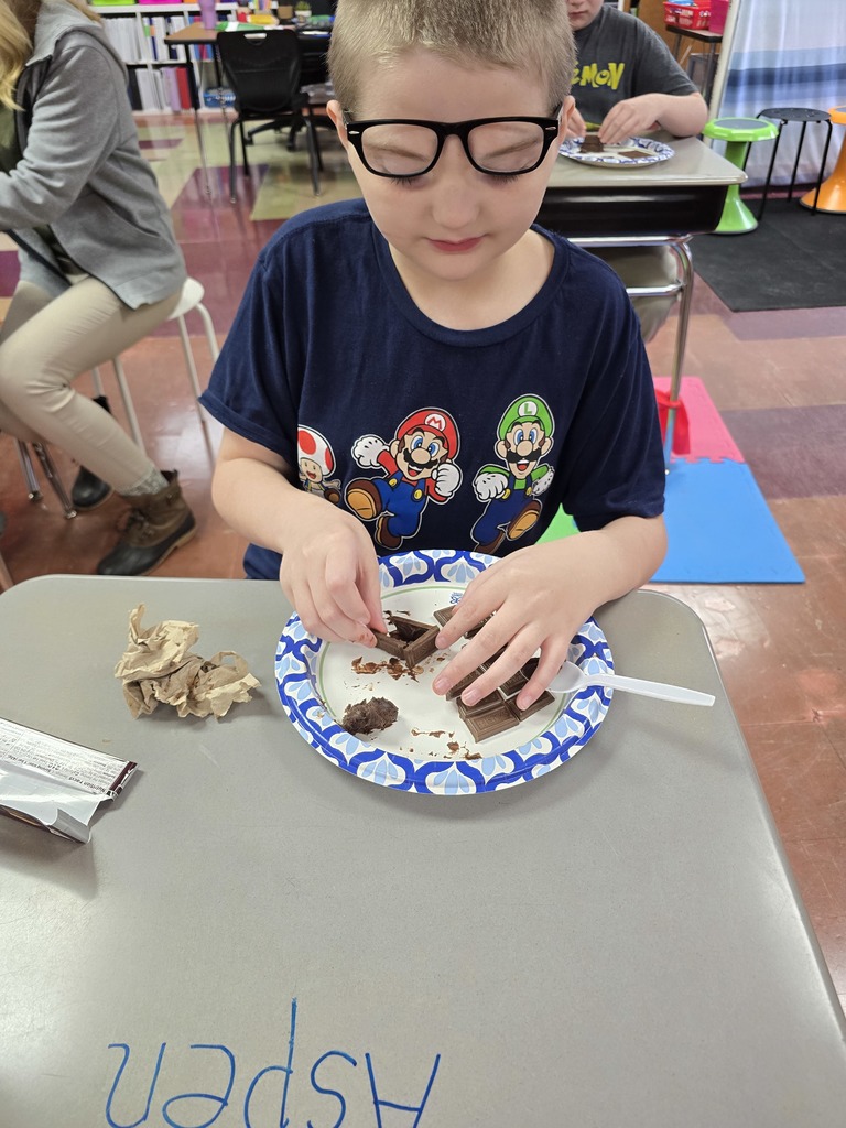 student making a house made of chocolate