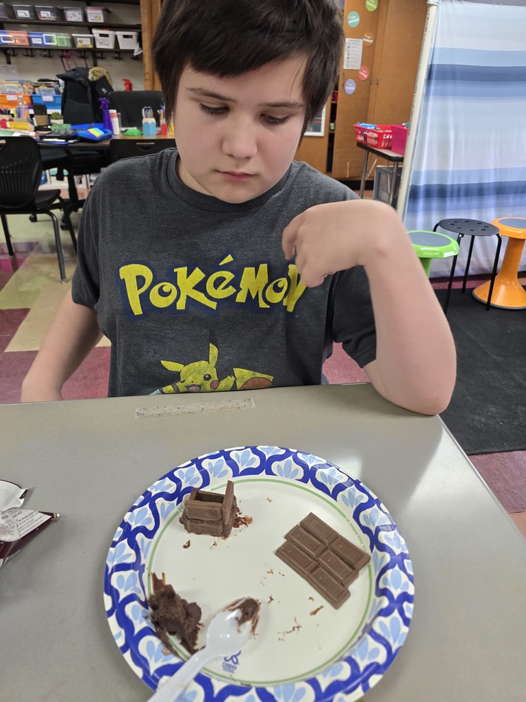 student making a house made of chocolate