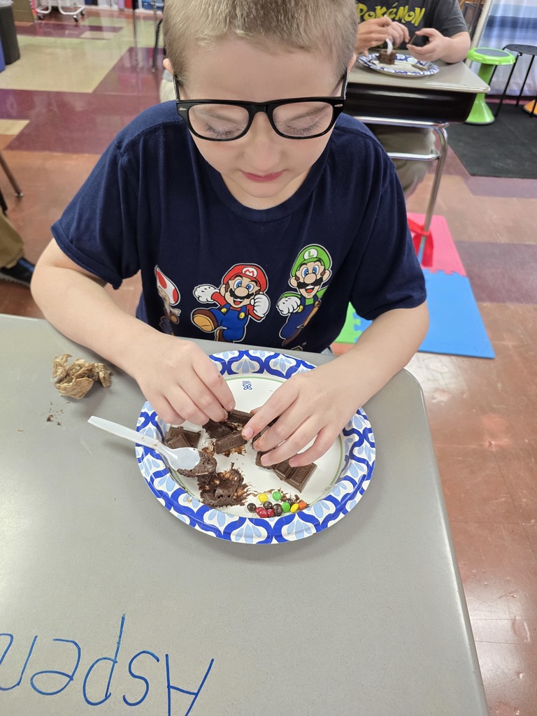 student making a house made of chocolate