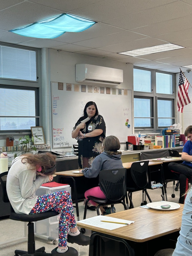 students listening to a speaker