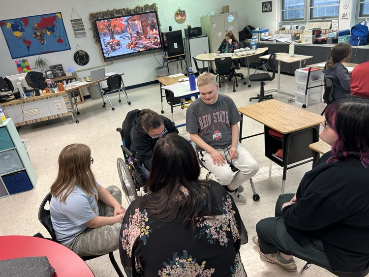 students listening to a speaker