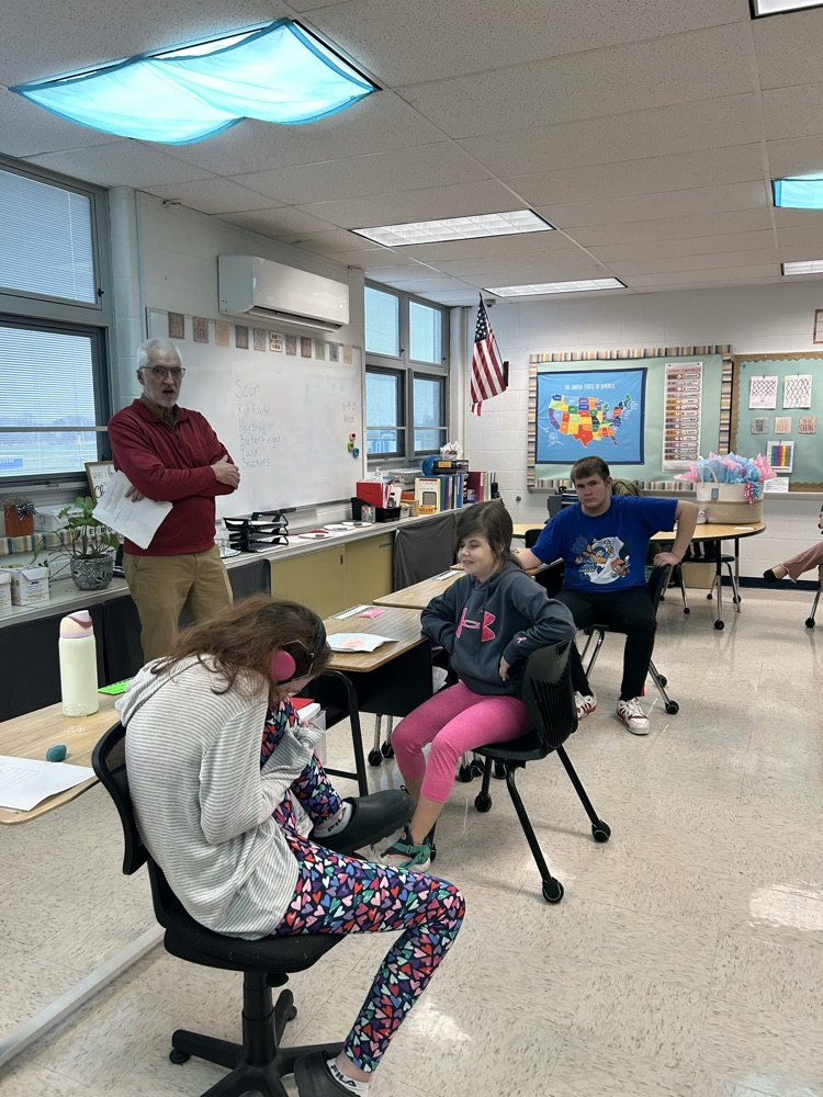 students listening to a speaker