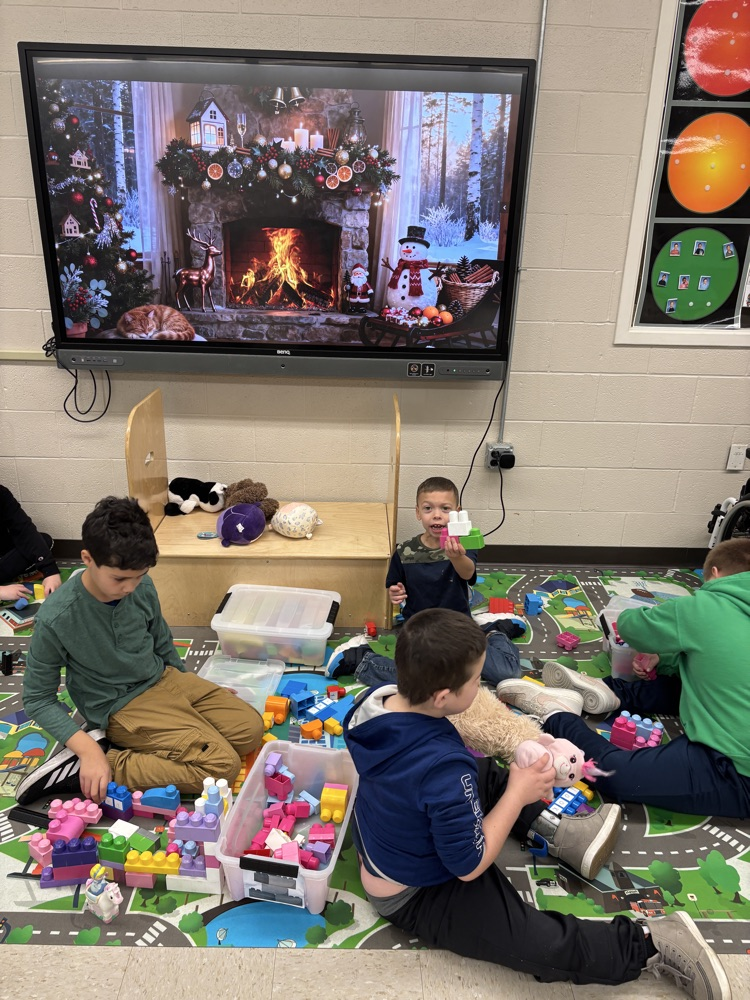 students building with stuffies 