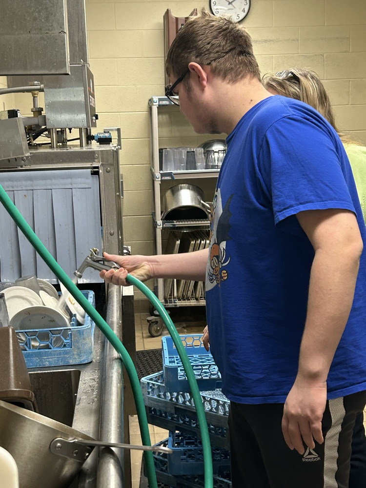 student at dishwasher 