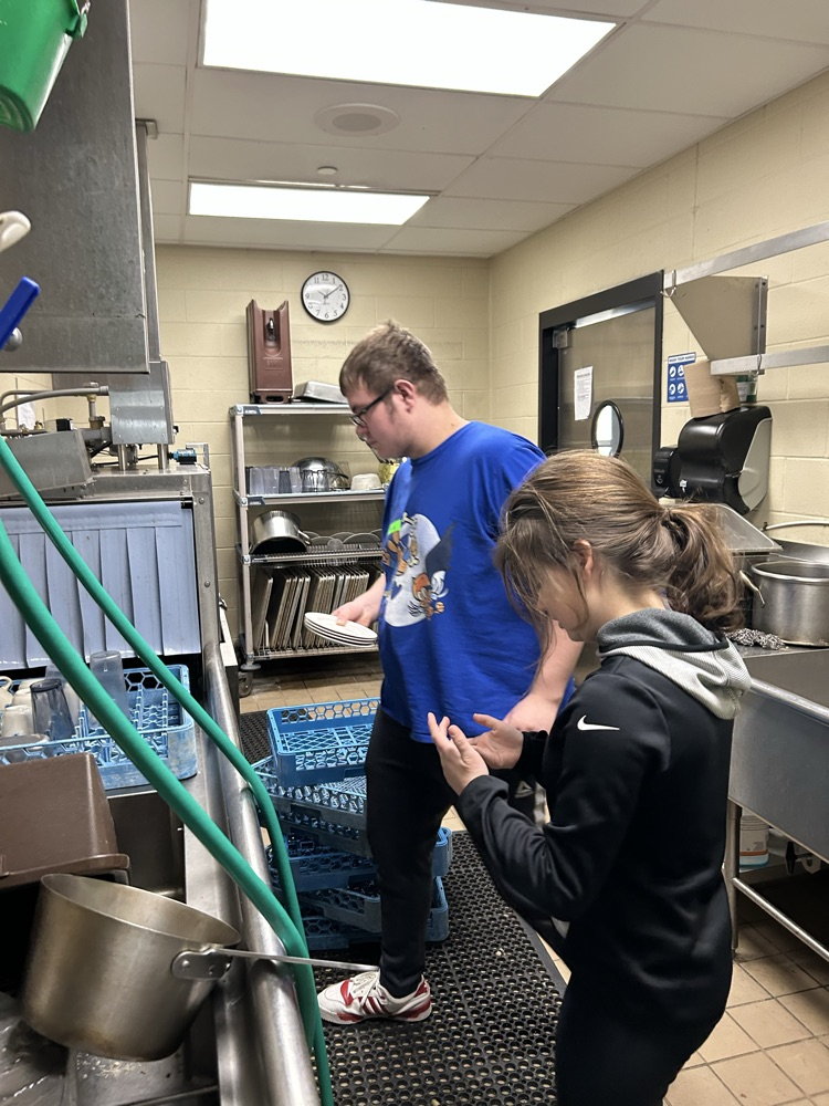 student at dishwasher 