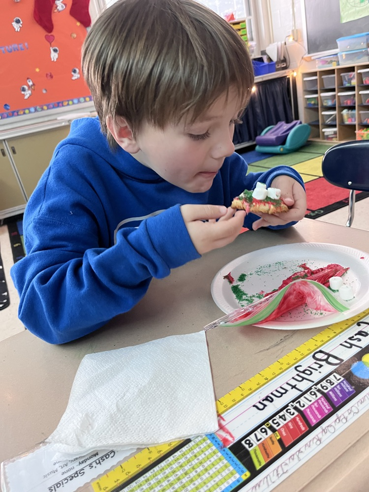 student decorating cookies
