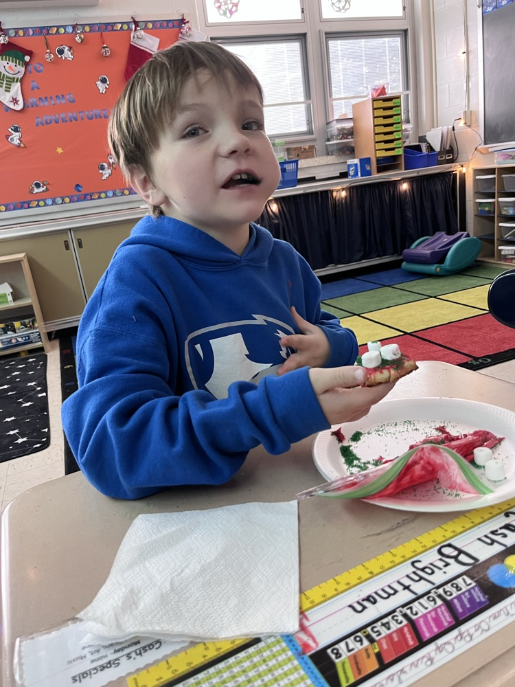 student decorating cookies