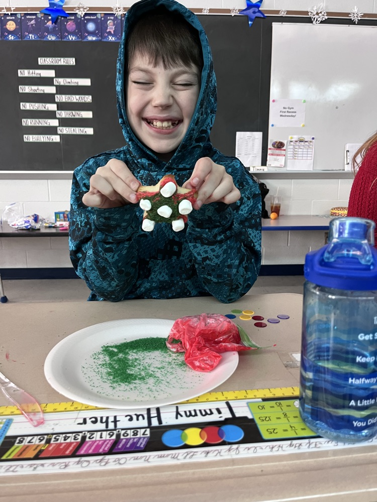 student decorating cookies