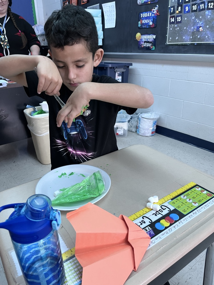 student decorating cookies