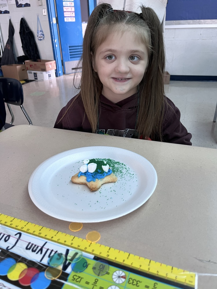 student decorating cookies