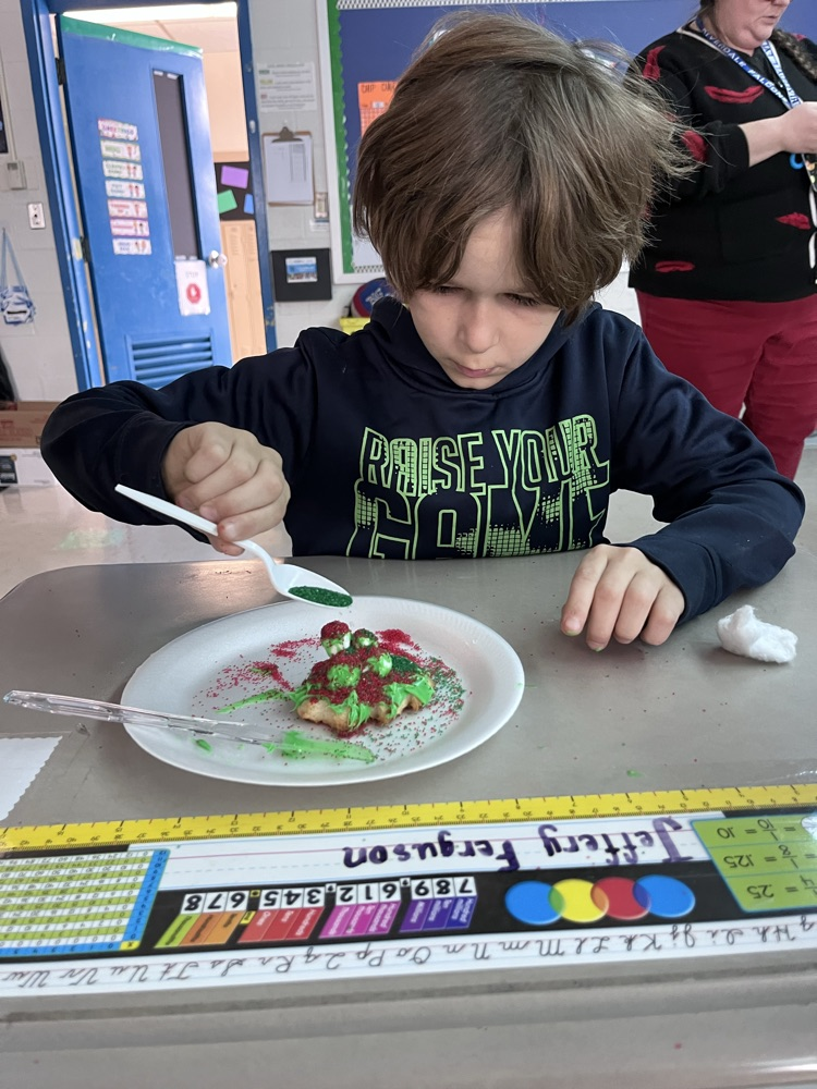 student decorating cookies