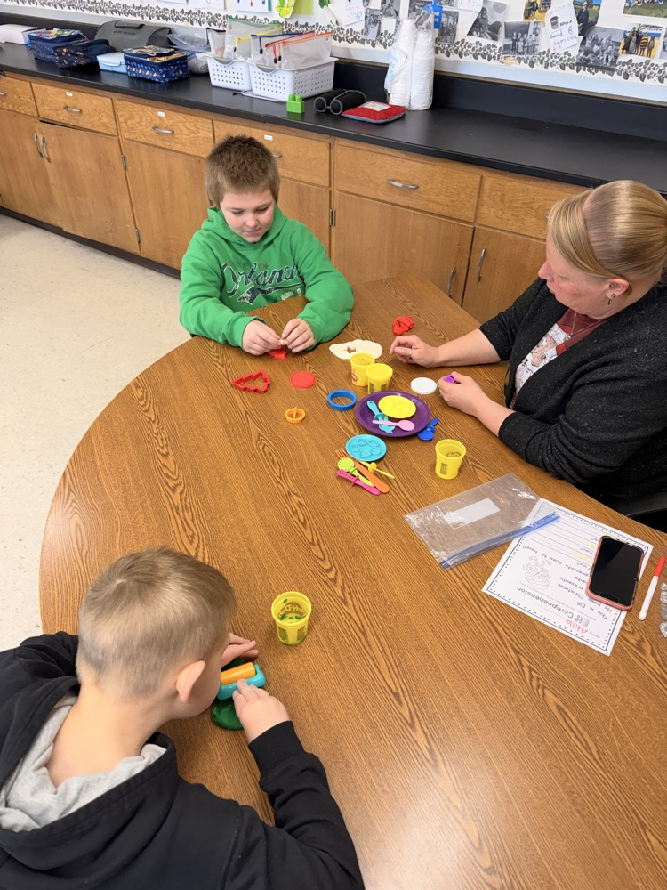 students making playdoh cookies
