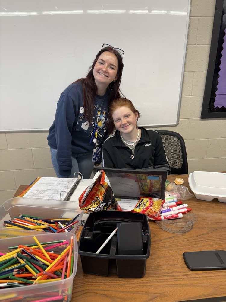 student painting ornament