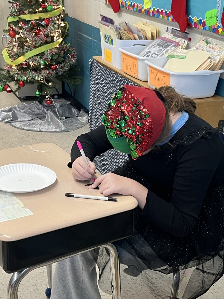 student painting ornament