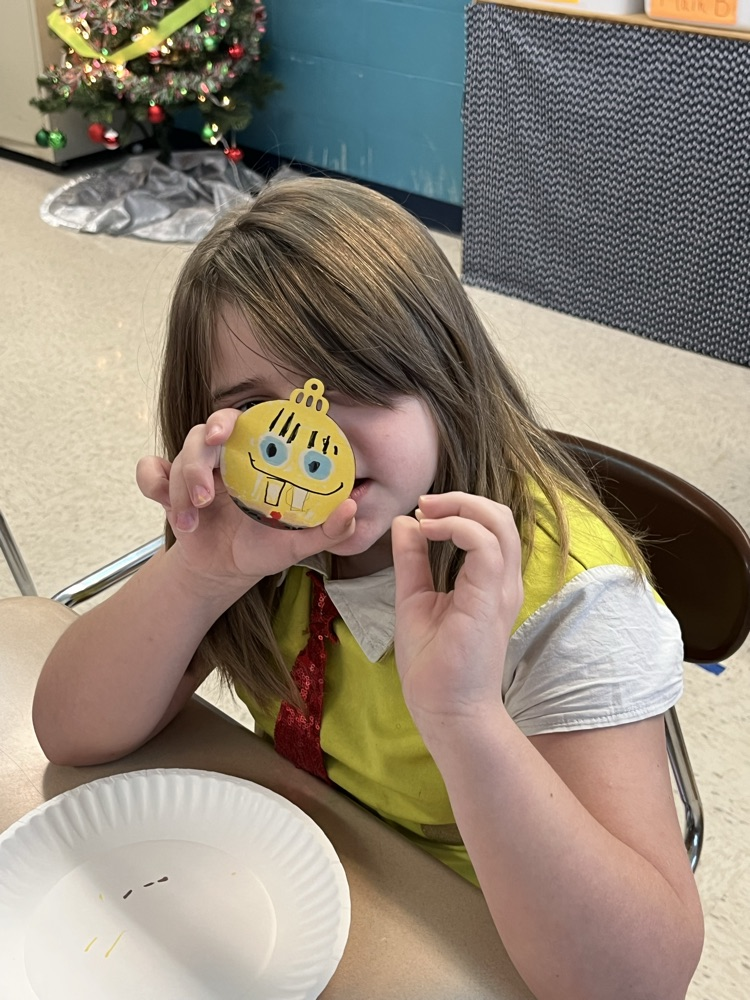 student painting ornament