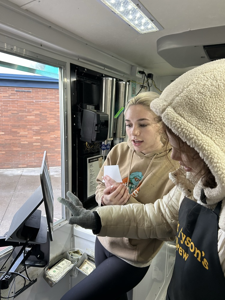 student taking orders 