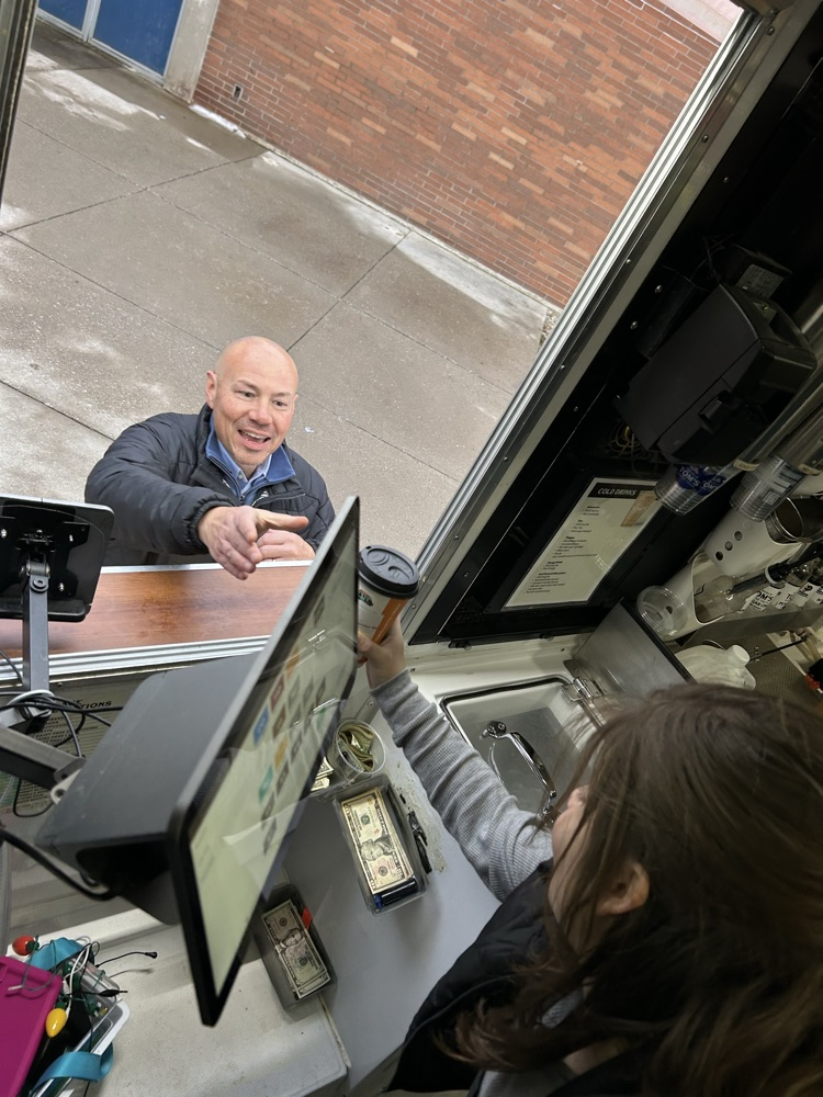 student taking orders 