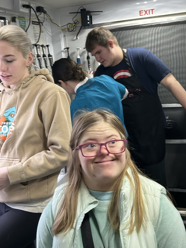 students working on coffee truck