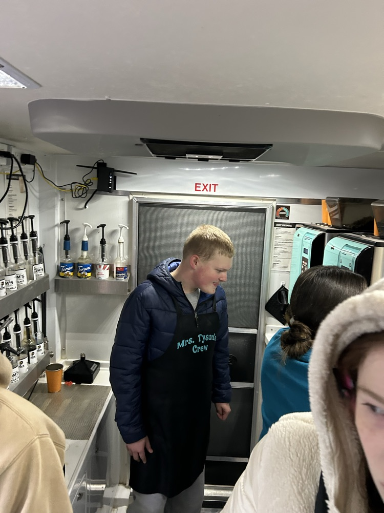 students working on coffee truck