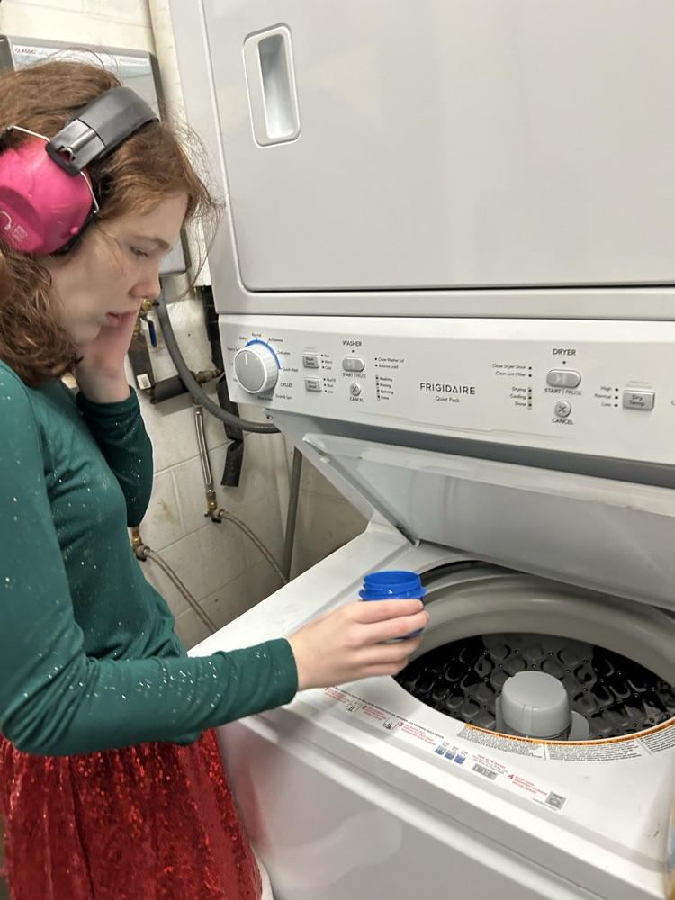 student doing laundry