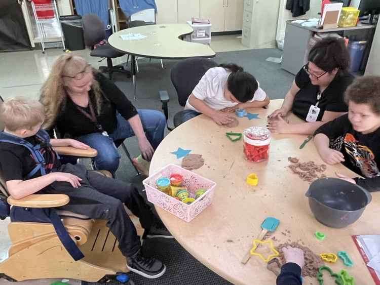 students using playdoh